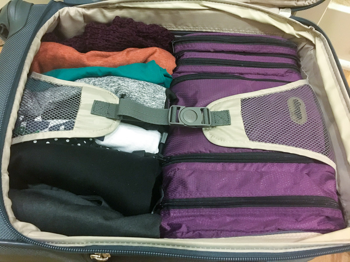 How to pack using the KonMari Method for holiday travel and 5 easy travel tips to use today by Dr. Jessica Louie of Clarify Simplify Align, Certified KonMari Consultant Pasadena Los Angeles, Salt Lake City, Brookfield Wisconsin. Coach intentional joyful life | minimalism | fit it all in carry-on suitcase, Lo & Sons backpack, eBags travel accessories, Samsonite 4-spinner suitcase